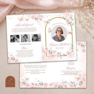 May include: A memorial card with a soft pink and gold floral design, featuring a photo of a woman and the text "Celebrating the Life of Eleanor Andrews." The card includes text about the deceased and family details.