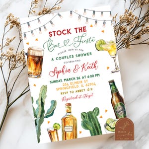 May include: A white invitation card with a red and green border. The text "Stock the Bar & Fiesta" is in red and green. The invitation is for a couples shower for Sophia & Keith. The date is Sunday, March 26 at 6:00 PM. The address is 234 Elmeir St, Springfield, IL 62704. The RSVP is to Abbey 12/2. The invitation is registered at Target. The invitation features a watercolor illustration of a cactus, a margarita, a beer, and a bottle of tequila.