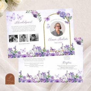 May include: A memorial card with a watercolour design featuring purple flowers and butterflies. The card includes a photo, the name "Eleanor Andrews", and the years 1945-20XX. Text includes "Acknowledgement" and details about a reception.