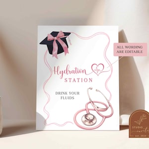 May include: Pink and black graduation party sign with a stethoscope, a graduation cap with a pink bow, and the text "Hydration Station" and "Drink Your Fluids". The sign also says "All wording are editable".