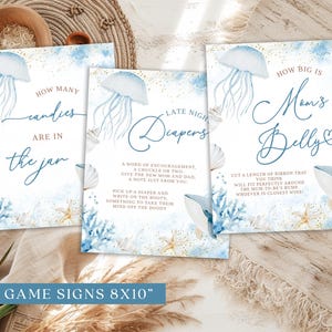 May include: Set of five baby shower game signs, each 8x10 inches, featuring a watercolor ocean theme. Designs include jellyfish, seashells, and whales, with phrases like "How Many Candies Are in the Jar?" and "How Big is Mom's Belly?"