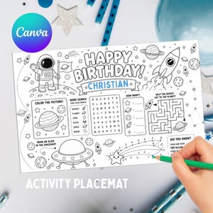 May include: Black and white activity placemat with a space theme. Features the text "Happy Birthday! Christian" and various space-related illustrations, including an astronaut, planets, rockets, and a maze. Includes word search and drawing activities.