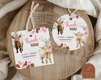 May include: Two thank you tags for a gender reveal party. The tags are 2 inches by 2 inches and feature a brown and pink cow print background with a watercolour illustration of a highland cow. The text on the tags reads "Thank You" and "Jennifer & Jason's Gender Reveal February 14th, 2024".