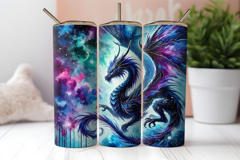 May include: Three stainless steel tumblers with a galaxy background and a blue dragon design. The dragon is depicted in a watercolor style with purple and blue hues.