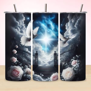 May include: Three stainless steel tumblers with a design of white doves flying towards a bright light in a cloudy sky. The tumblers have a black background with white roses and a gate.