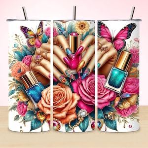 May include: A white tumbler with a colorful design featuring butterflies, flowers, and nail polish bottles. The design includes a hand with manicured nails and a pink and blue color scheme.