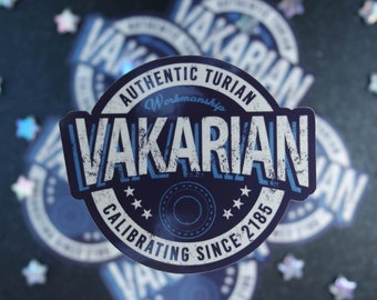 May include: A blue and white sticker with the text "VAKARIAN" in a distressed font. The sticker also includes the phrases "AUTHENTIC TURIAN Workmanship" and "CALIBRATING SINCE 2185". The sticker has a circular design with stars.