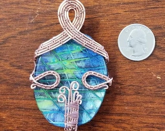 Wire wrap pendant Polymer Clay and resin center piece