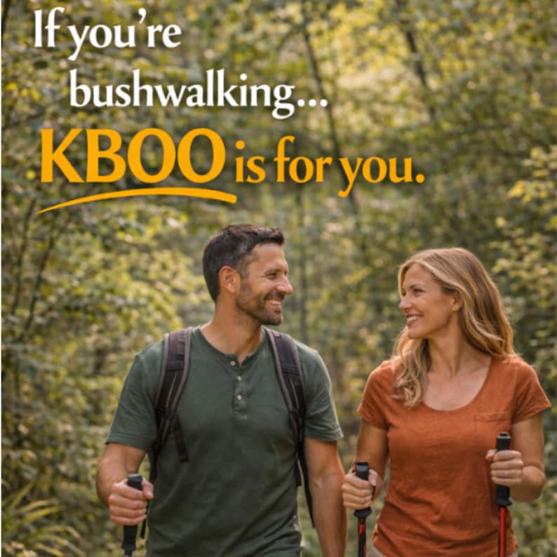 May include: A couple smiles while hiking in a forest, each holding trekking poles. The woman wears an orange shirt, and the man wears a green shirt. Text at the top reads, "If you're bushwalking... KBOO is for you."