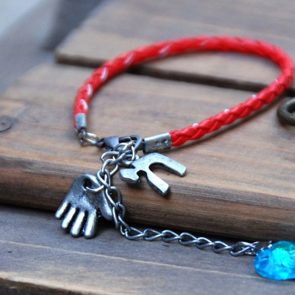 Red string Kabbalah bracelet with 3 charms