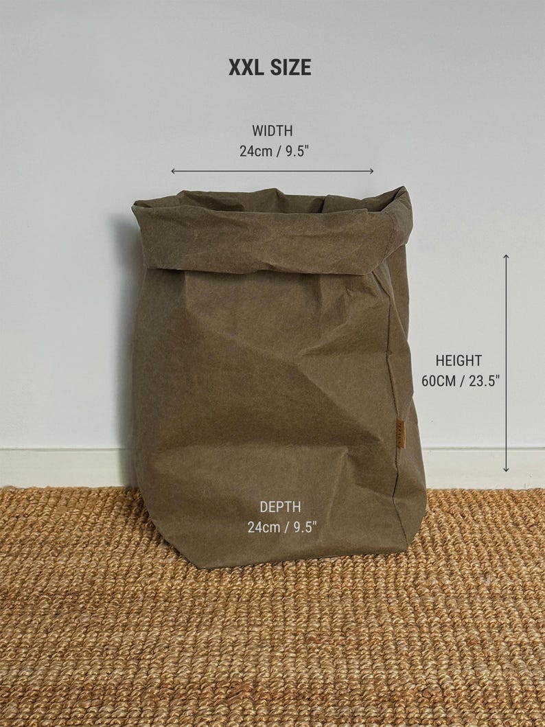 May include: An XXL size brown storage bag with a folded top edge. The bag features a width of 9.5 inches, a depth of 9.5 inches, and a height of 23.5 inches. The text XXL SIZE, WIDTH 9.5", HEIGHT 23.5", and DEPTH 9.5" is printed on the image.