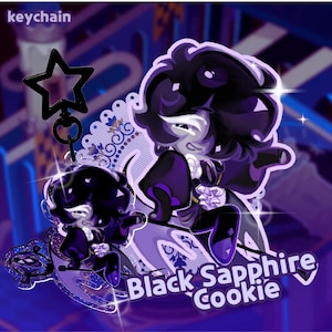 May include: A keychain featuring a cartoon character with black hair and a purple outfit. The keychain has a star-shaped charm and the text "Black Sapphire Cookie". The background is a dark purple color.