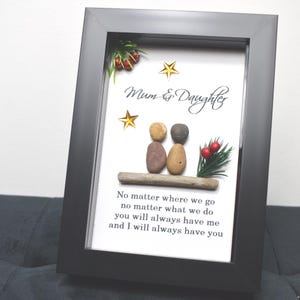 May include: A framed artwork featuring a pebble art design of two figures, representing a mother and daughter, with the text "Mum & Daughter" and a quote: "No matter where we go no matter what we do you will always have me and I will always have you".