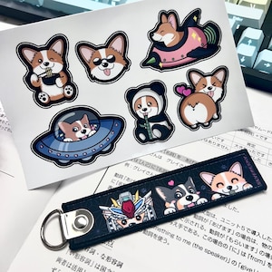 May include: A set of eight stickers featuring cartoon corgis in various poses. The stickers are printed on white paper and feature a variety of colors, including black, white, pink, red, and blue. The stickers are perfect for adding a touch of whimsy to laptops, water bottles, or other surfaces.