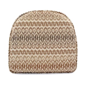 May include: A U-shaped chair cushion featuring a repeating ikat pattern in shades of brown, tan, and cream. The cushion has a rounded top edge, a flat bottom edge, and is finished with a matching fabric piping along the entire outer perimeter.