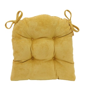 May include: A mustard yellow square chair cushion featuring a soft corduroy-like texture, four tufted buttons arranged in a central square pattern, and two fabric ties at the top corners for securing the cushion to a chair frame.