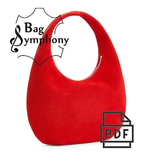Könnte beinhalten: Eine rote, halbmondförmige Handtasche mit Reißverschluss. Die Tasche ist aus einem weichen, daimartigen Material gefertigt. Das Bild enthält den Text "Bag Symphony" und ein PDF-Symbol.