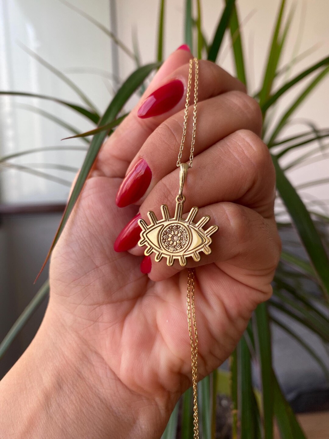 Mana Made Golden Eye Necklace main image 0