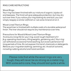 May include: Ring care instructions text on a white background. The text details care for wood and wood-lined titanium rings, including oiling, avoiding harsh chemicals, and submersion. A teal box at the bottom provides additional care advice.