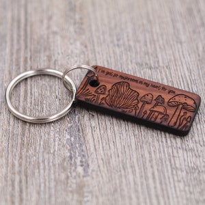 May include: Wooden keychain with a mushroom design and the text "I've got so mushrooms in my heart for you".