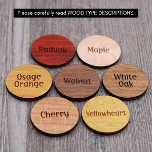 May include: Close-up of eight round wooden samples with different wood types labeled: Paduak, Maple, Osage Orange, Walnut, White Oak, Cherry, Yellowheart.