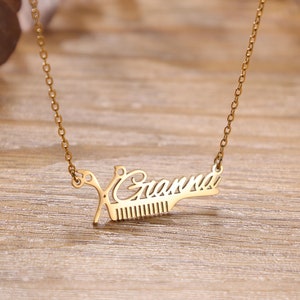May include: Gold necklace with a pendant that says "Grandma" with a pair of scissors and a comb.