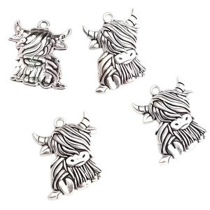 May include: Four silver-coloured Highland cow charms. Each charm features a detailed design of a Highland cow with horns, long fur, and a small loop at the top for attaching to jewellery or crafts. The charms are on a white background.