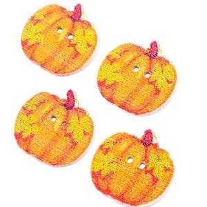 May include: Four flat, pumpkin-shaped buttons made of wood. Each button features a vibrant orange and yellow gradient print with a visible wood grain texture, a small dark red stem at the top, and two central holes for sewing attachment.