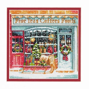 May include: Cross-stitch depiction of a shop front, featuring the text "Fine Teas Coffees Foods." The shop has a Christmas tree, gifts, and a wreath. Snow falls on the building and a sign that says "Hot Pie."