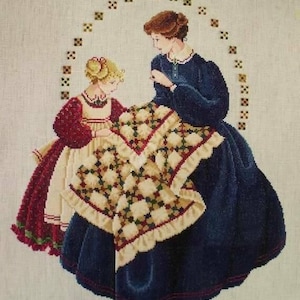May include: A cross-stitch embroidery of two women, one older and one younger, working on a quilt. The older woman is wearing a blue dress and the younger woman is wearing a red and white dress. The quilt is made of patchwork squares in various colors and patterns.