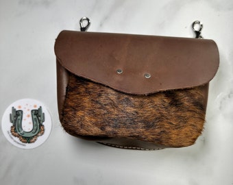 Leather bum bag with brown hair on cowhide, interior card pocket. Cowgirl hip phone holster is ideal for trail and horseback riding