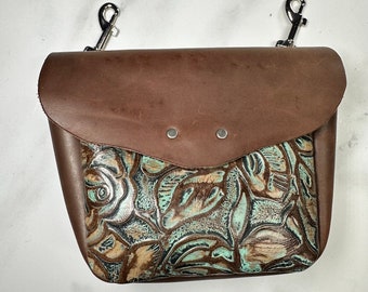 Leather bum bag with brown and aqua floral print cowhide, interior card pocket. Cowgirl hip phone holster for trail and horseback riding