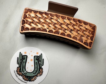 Four inch hair claw clip with  hand tooled basketweave leather patch. One of a kind hair accessory is a great Christmas or bridesmaid gift.