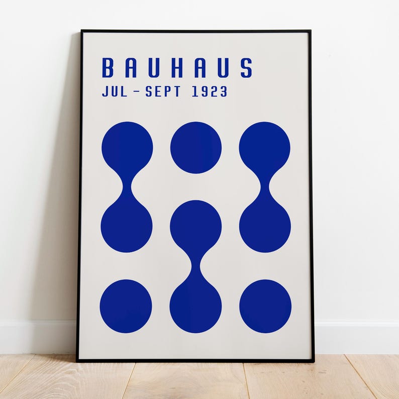May include: A black and white poster with the text "BAUHAUS JUL - SEPT 1923" and a pattern of nine blue circles.