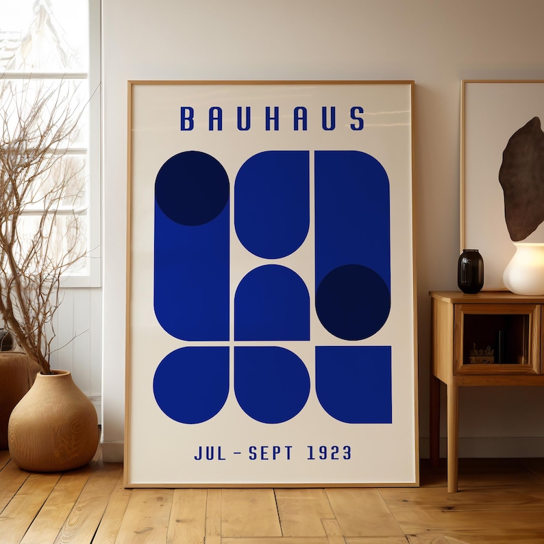 May include: A poster with the text "BAUHHAUS JUL - SEPT 1923" and a geometric design of blue circles and rounded rectangles.