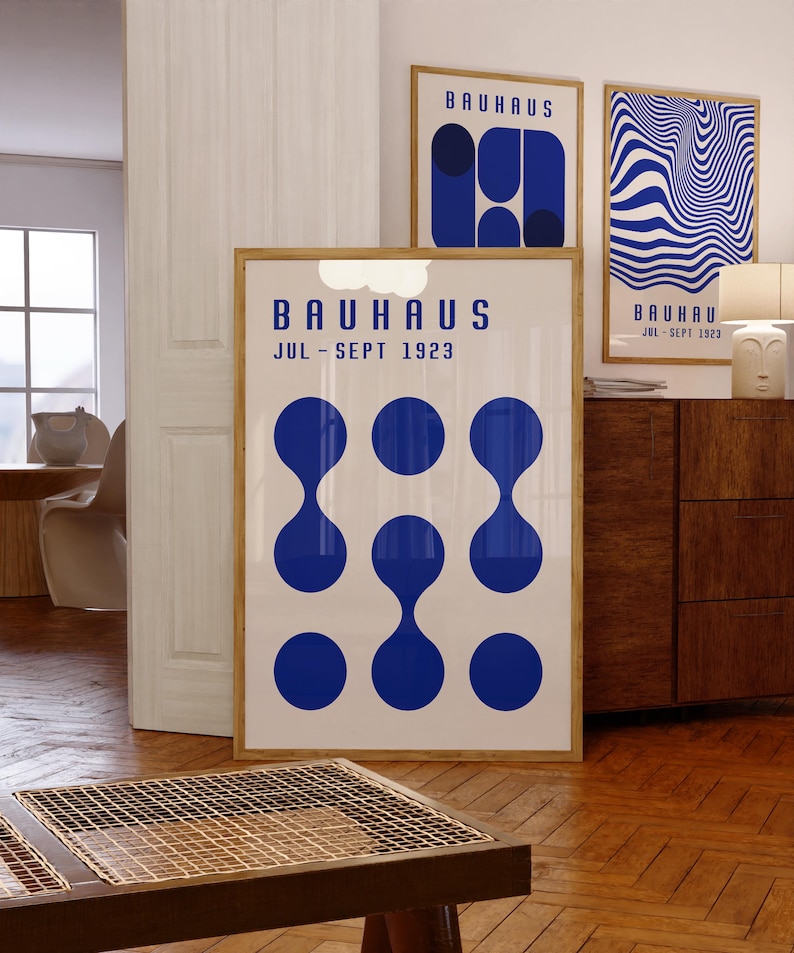 May include: Three Bauhaus style posters with blue and white geometric designs. The posters feature the text "Bauhaus Jul - Sept 1923".