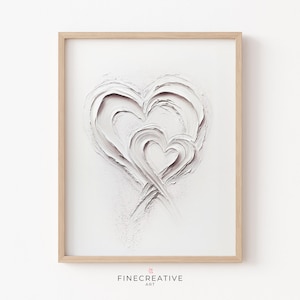 Può includere: Una stampa incorniciata bianca con un designo testurizzato bianco di due cuori sovrapposti. I cuori sono creati con pennellate spesse e sono centrati sullo sfondo bianco.