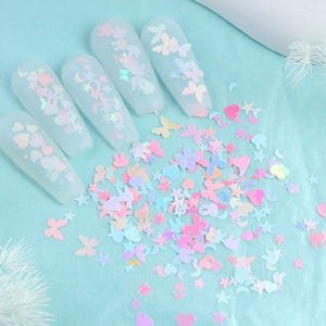 Set van 6 pastelkleurige dromerige lucht glittervlokken (vlinder, maan, ster)