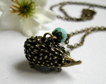 Little hedgehog necklace, brass charm, glass turquoise bead, women's necklace, long brass chain, woodland animal necklace