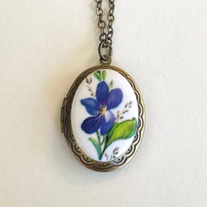 Blue violet locket necklace, oval brass locket, wildflower necklace, unique gift for mom, keepsake jewelry, gift for her, spring flowers