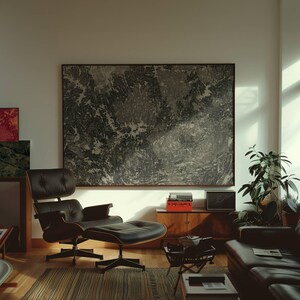 May include: A mid-century modern living room with a black leather lounge chair and ottoman. A large abstract painting hangs on the wall. A wooden cabinet holds a record player and other items. A potted plant sits in the corner.