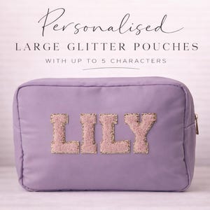 May include: A lilac-coloured, rectangular glitter pouch with the name "LILY" in pink and gold glitter letters. The pouch has a zip closure and the text "Personalised Large Glitter Pouches" is at the top.