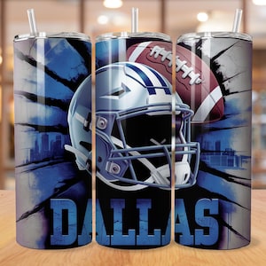 May include: A set of three stainless steel tumblers with lids and straws. Each tumbler features a blue and white design with a football helmet, football, and the word "DALLAS". The background has a cityscape design.