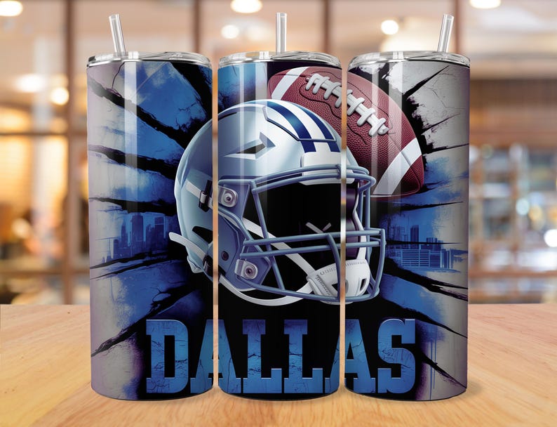 May include: A set of three stainless steel tumblers with lids and straws. Each tumbler features a blue and white design with a football helmet, football, and the word "DALLAS". The background has a cityscape design.