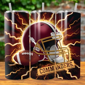 May include: A stainless steel tumbler with a burgundy and gold design featuring a football helmet and football. The tumbler has a lightning bolt pattern and the text "COMMANDERS" on the side.