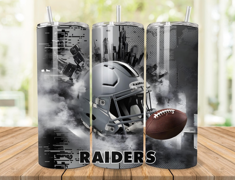 May include: Three stainless steel tumblers with a black and white design featuring a football helmet, a football, and the word "RAIDERS".