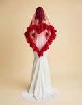 Unique red heart-shaped veil. Elegant heart-shaped fringed veil. Minimalist veil made of tulle and chiffon. Handmade, custom veil. product logo