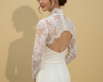 Accessoires afneembare boleromouwen: elegante kanten bolero met lange mouwen. Afneembare accessoires voor de bruid. Elegante vintage lange mouwen.