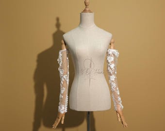 Accesorios de novia con mangas desmontables: Elegantes mangas de encaje floral y cuentas. Mangas largas y desmontables para eventos formales.