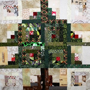 May include: A green, brown and white patchwork quilt block with a tree-like design. The block is made up of many small squares of fabric, each with a different pattern.
